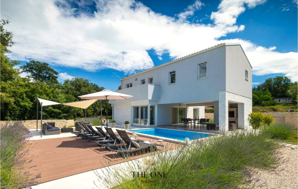Modern house with a pool offers 4 bedrooms, 4 bathrooms, sauna, private parking space.